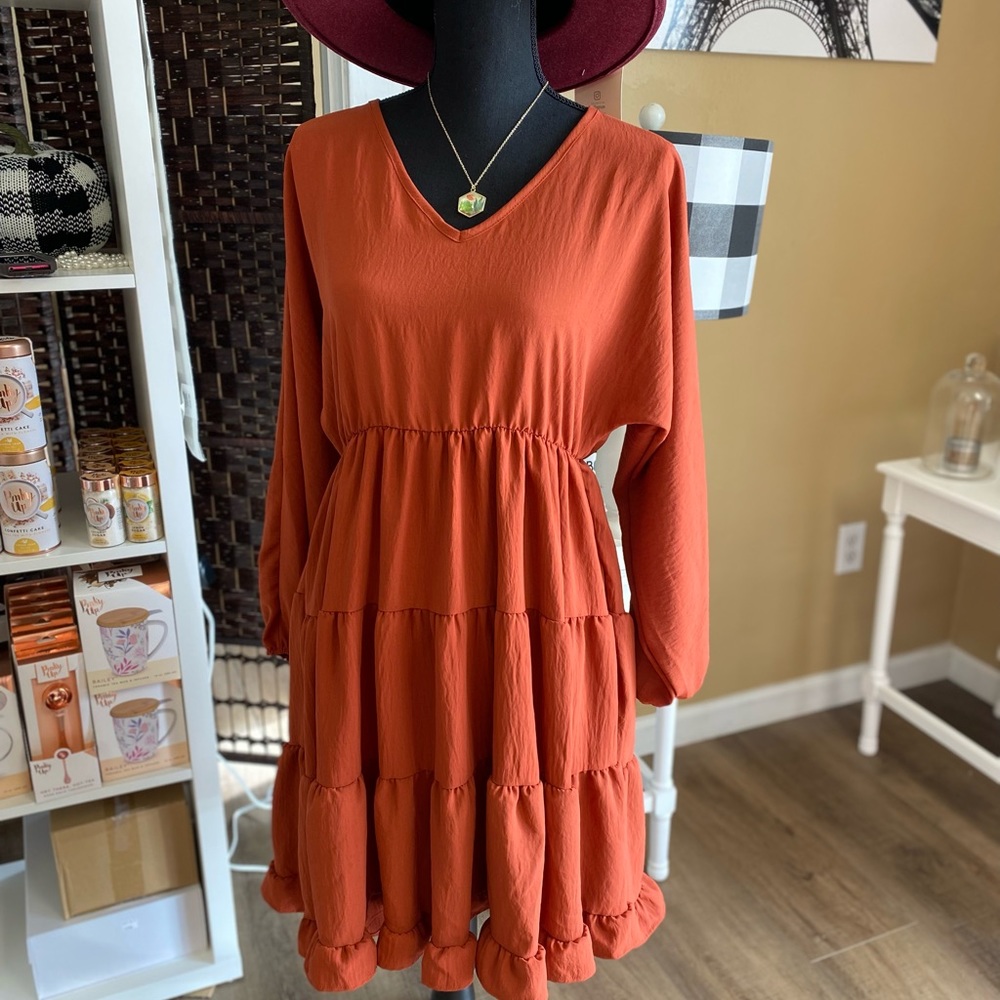 Tiered rust colored long sleeve dress